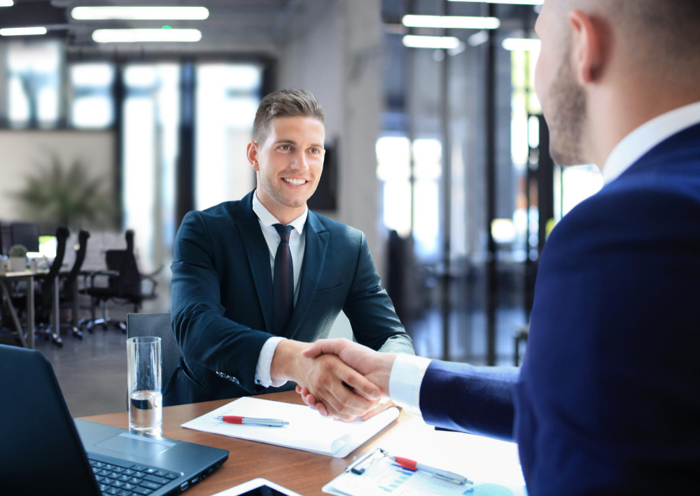 business handshake two businessman shaking hands office